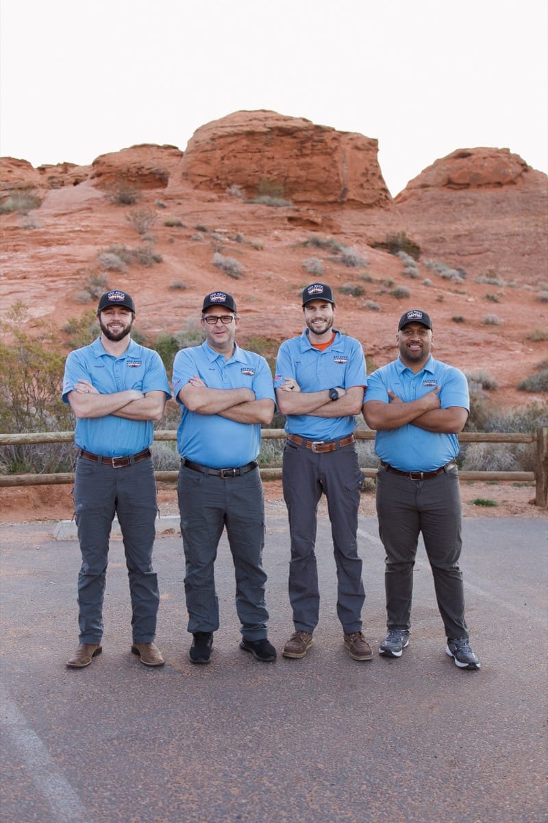 Red Rock Plumbing team in front of red rock formations in Southern Utah